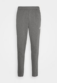 Grijze joggingbroek van zacht materiaal, met een taps toelopend ontwerp, elastische tailleband en subtiele logo-accent op de linker dij.