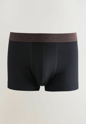 Boxers noirs en tissu doux avec une taille de couleur marron foncé portant le logo "NEXT" en relief. Comprend des détails cousus sur les côtés.