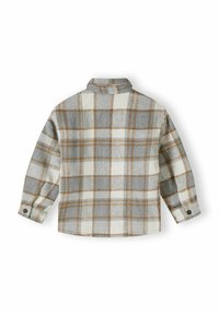 Chemise en flanelle à carreaux présentant des carrés gris, blancs et brun orangé, à manches longues et col avec des poignets à boutons. Texture douce.