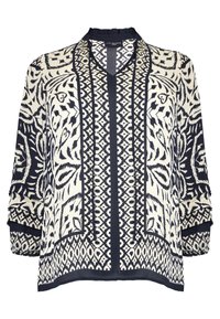 Lättviktig blus med mönster som har en geometrisk design i marinblått och krämvitt, med mandarin-krage och lösa trekvartsärmar.