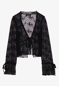 Blouse longue en dentelle noire transparente à manches longues, motif floral, encolure en V profonde, fermeture à nouer à l'avant et poignets à volants avec liens.