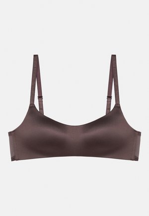 Brown, seamless bra with a smooth, satin-like finish. Features adjustable straps and a minimalist design without embellishments.