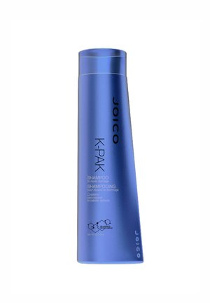 Joico K-Pak shampoo in a tall, blue plastic bottle with a curved shape. Label features logo, product name, and usage instructions in white text.