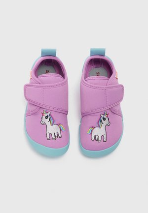 Purple fabric shoes with a turquoise sole, featuring a side-stitched rainbow unicorn design and a Velcro closure for easy wear.