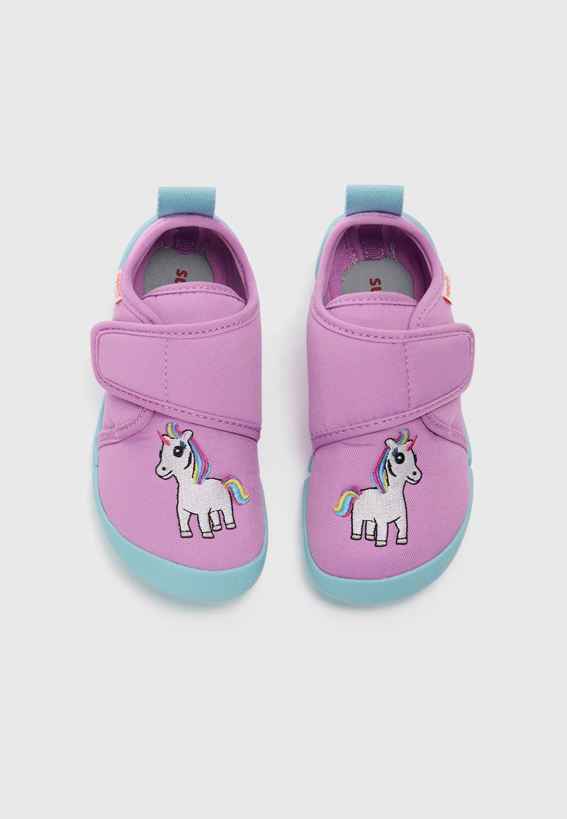 Purple fabric shoes with a turquoise sole, featuring a side-stitched rainbow unicorn design and a Velcro closure for easy wear.
