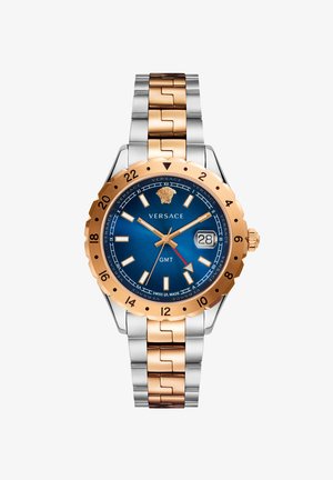 Versace GMT-Uhr mit blauer Zifferblatt, goldfarbener Lünette und braun-silbernem Armband. Verfügt über lumineszierende Markierungen und eine Datumsanzeige.