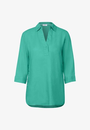 Tyrkisk shirt lavet af glat, letvægtsstof. Har en krave, trekvartlange ærmer og en lige søm.