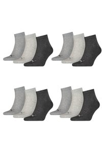 Ein Sortiment aus sechs Paaren von Knöchelsocken in Grautönen, mit gerippten Bündchen und Logo-Akzenten, die unterschiedliche Texturen zeigen.