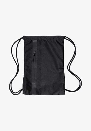 Sac à cordon noir Nike avec poche avant verticale zippée et fines cordelettes d'épaule sur fond blanc.