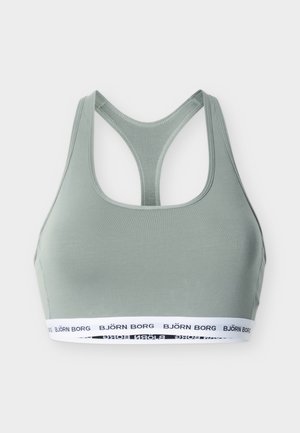 Hellgrüner Racerback-Sport-BH mit elastischem weißem Bund unten, gebrandmarkt mit "BJÖRN BORG" in schwarzem Text.