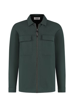 Grüne Zip-Up-Bluse aus strukturiertem Stoff. Verfügt über einen Kragen, zwei Brusttaschen und lange Ärmel mit knöpfbaren Manschetten.