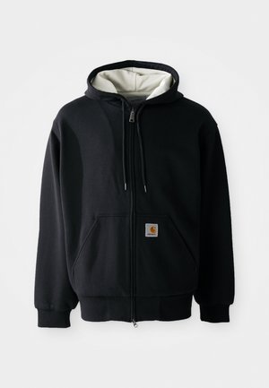 Hoodie zippé noir avec une doublure intérieure blanche, poches avant, capuche avec cordon de serrage et un petit patch logo sur la poche gauche. Texture de tissu lisse.