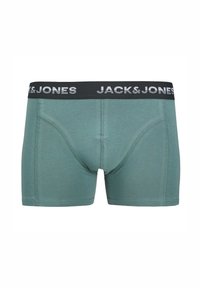 Grüne Baumwoll-Boxershorts mit einem schwarzen Bund, der die „JACK & JONES“-Markenbeschriftung in Weiß aufweist. Glatte Textur und enganliegendes Design.