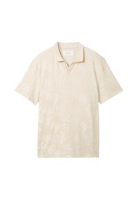 Kortärmad pikétröja i ljusbeige med ett subtilt palmlövmönster, tillverkad av mjukt tyg och med en klassisk krage.