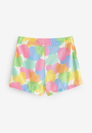 Värvilised lühikesed püksid, millel on suur südame muster pastelselt roosa, sinise, kollase ja rohelise tooni kombinatsioon; valmistatud kerge tunni materjalist.