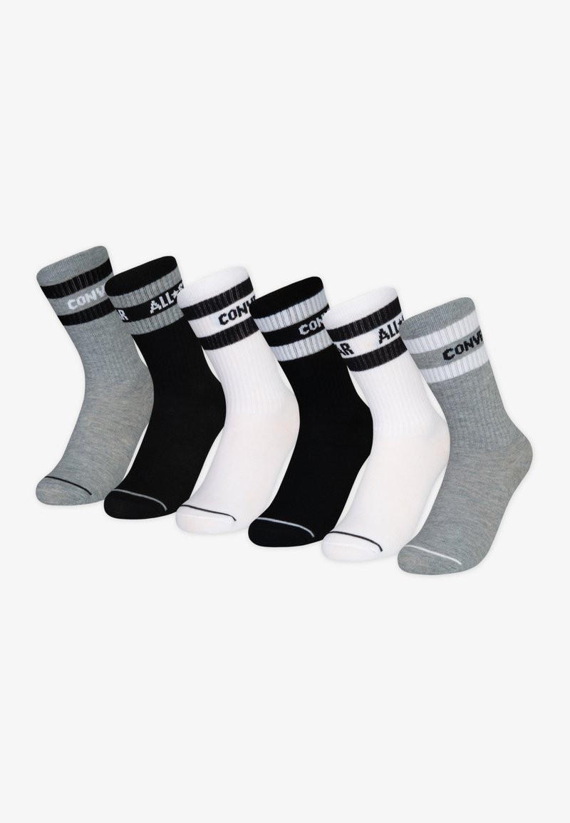 Sei paia di calze lunghe da ciabatta in grigio, nero e bianco. Ognuna ha un corpo di colore uniforme e una fascia a righe contrastante con del testo.
