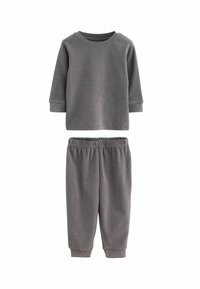 Szara bawełniana bluza z długim rękawem i okrągłym dekoltem, w połączeniu z pasującymi dresami na gumce. Miękka faktura, prosty design, luźny krój.