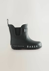 Botte de pluie noire en caoutchouc jusqu'à la cheville avec un logo blanc sur le côté, présentant une semelle texturée, des panneaux élastiques et une languette à l'arrière.