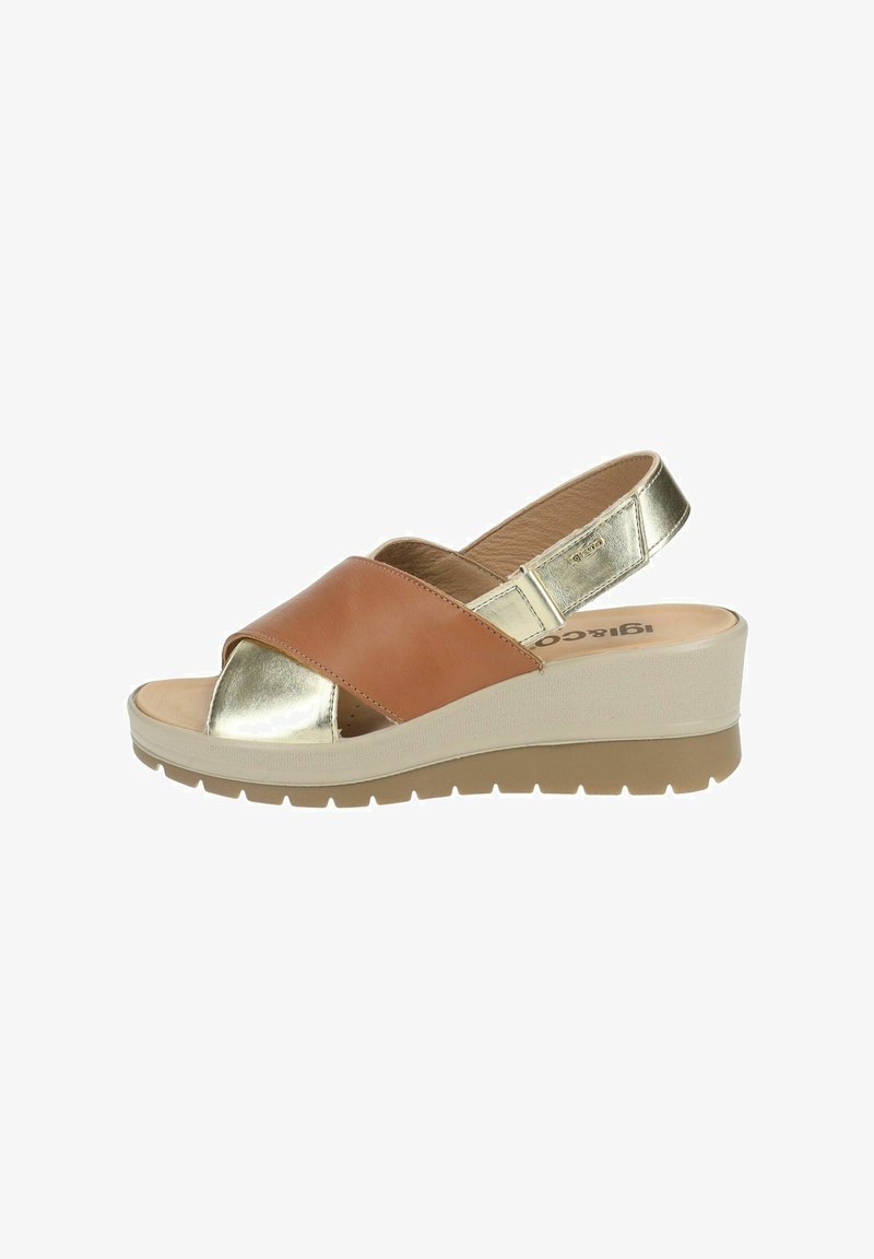 Brown and metallic gold slingback sandals with a wedge heel, featuring a cross-strap design and a textured sole for grip.
