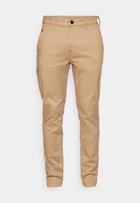 Khačaste chinos hlače s slim fit krojem, ki vključujejo sprednjo gumbno zapiranje, pet žepov in gladko bombažno tkanino. Rahlo zožen kroj nog. 