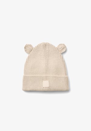 Bonnet tricoté couleur crème avec bord retourné et deux petites oreilles rondes sur le dessus, conçu pour les enfants.