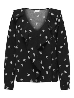 Schwarze Bluse mit V-Ausschnitt, die weiße Blättermuster und eine Rüsche an der Vorderseite aufweist. Lange Ärmel und Manschetten. Aus weichem Stoff gefertigt.