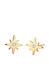 Goldene sternförmige Ohrringe mit einem zentralen klaren Edelstein, ausgestattet mit scharfen Spitzen und einer polierten Oberfläche. Elegantes Design, das sich für verschiedene Anlässe eignet.