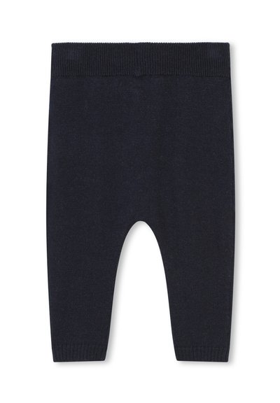 Donkerblauwe gebreide peuterleggingen met een geribde tailleband en boorden. Heeft een zachte textuur en een eenvoudig, minimalistisch ontwerp.