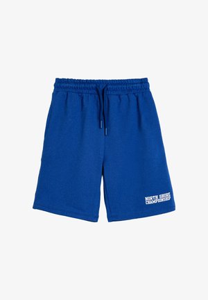 Pantalones cortos de algodón azul con cintura elástica y cordón. Presenta el texto "CAMPEONATO NORTH SHORE" en blanco en el dobladillo.