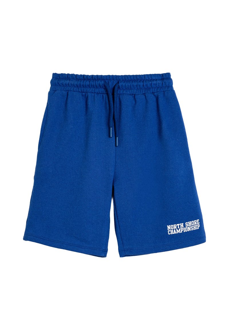 Blå bomuldsshorts med elastisk talje og snor. Har teksten "NORTH SHORE CHAMPIONSHIP" i hvidt på kanten.