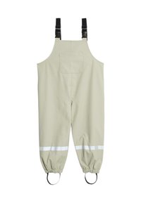 Beige vandtætte overalls med justerbare sorte stropper, brystlomme foran, elastiske manchetter, reflekterende bånd over anklerne og fodstropper.
