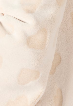 Tissu en polaire beige présentant une texture douce avec des motifs abstraits beige clair subtils et des nuances variées sur toute la surface.