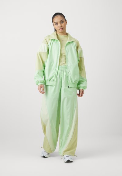adidas by Stella McCartney TRACKTOP - Training jacket - glow green/halo gold