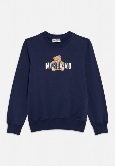 Sweat-shirt bleu marine avec poignets et ourlet côtelés, arborant un ours en peluche et le texte "MOSCHINO" sur la poitrine.