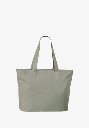 Sac fourre-tout vert clair en tissu doux. Dispose de deux poignées robustes et du logo en relief "Bench." sur le devant. Design simple et rectangulaire.
