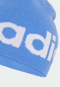 Knit beanie in light blue with a white logo design. Textured fabric with a snug fit, featuring contrasting color accents at the brim.
