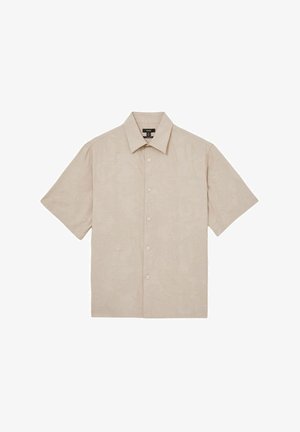 Cămașă cu mânecă scurtă, de culoare bej deschis, cu un model subtil de broderie florală. Dispune de un guler tip fold-over și închidere frontală cu nasturi.