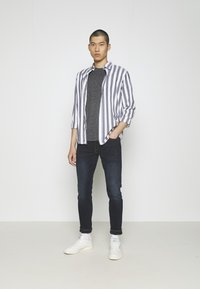 Levi's® 512® SLIM TAPER - Calças de ganga justas - shake the boat