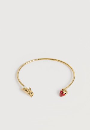 Thin open gold bracelet with a rabbit head on one end and a red strawberry on the other.