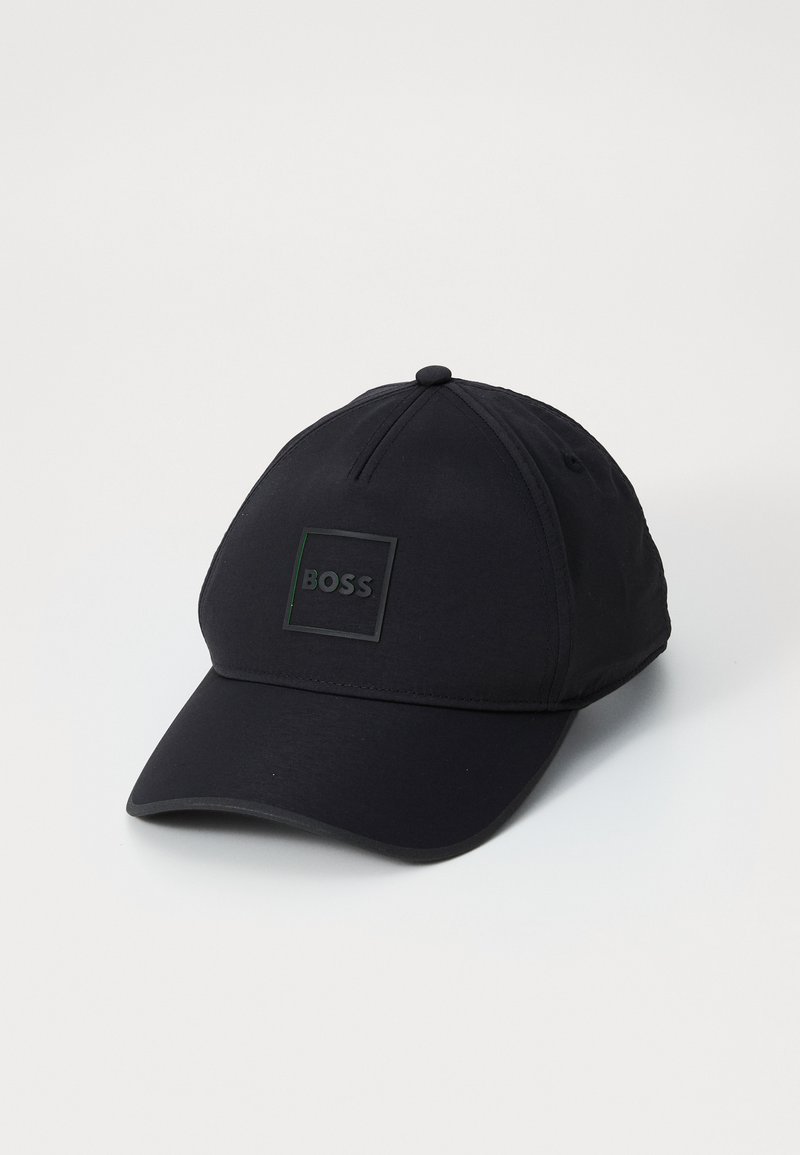 Black baseball cap made of fabric with a smooth texture. Features a square logo patch marked "BOSS" in the center. Curved brim.