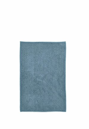 Rectangular blue bath mat with a textured surface made of soft, small looped fabric fibers and stitched edges.