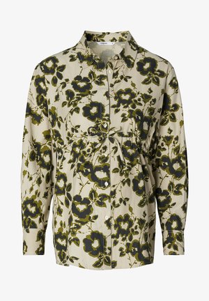 Langarmhemd in beige met groene en zwarte bloemenprint. Heeft een kraag, knopsluiting aan de voorkant en een geplooid taille-detail.