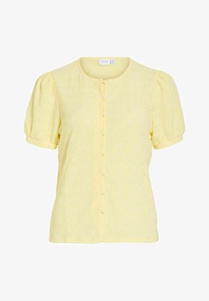 Gele blouse met korte mouwen, ronde hals, knoopsluiting aan de voorkant, pofmouwen en bloemrijk opengewerkt borduurpatroon.