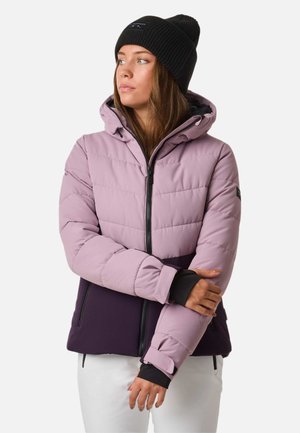 Purple and light pink insulated jacket with a hood, featuring a zipper closure and black accents. Ribbed black beanie worn on the head.