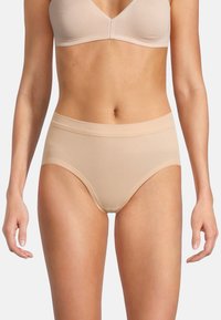 Mutande alte in cotone beige con una texture liscia, ampia fascia elastica in vita e design minimalista. Adatte per l'uso quotidiano.