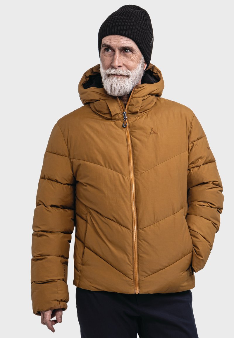 Braune Pufferjacke mit Reißverschluss vorne, Kapuze und gestepptem Design. Verfügt über elastische Bündchen und ein Logo-Akzent auf der linken Brust.