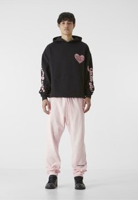 9N1M SENSE ESSENTIAL - Träningsbyxor - pink