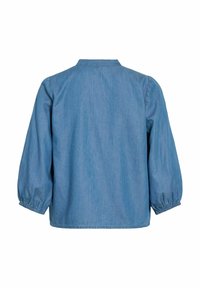 Vue de dos d'une chemise en jean bleu moyen à manches longues, avec un col droit et des poignets élastiques aux manches.