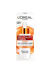 Sérum Revitalift Clinical de L'Oréal Paris dans un flacon en verre blanc avec un compte-gouttes. Il présente un accent doré et un design circulaire orange sur la boîte.