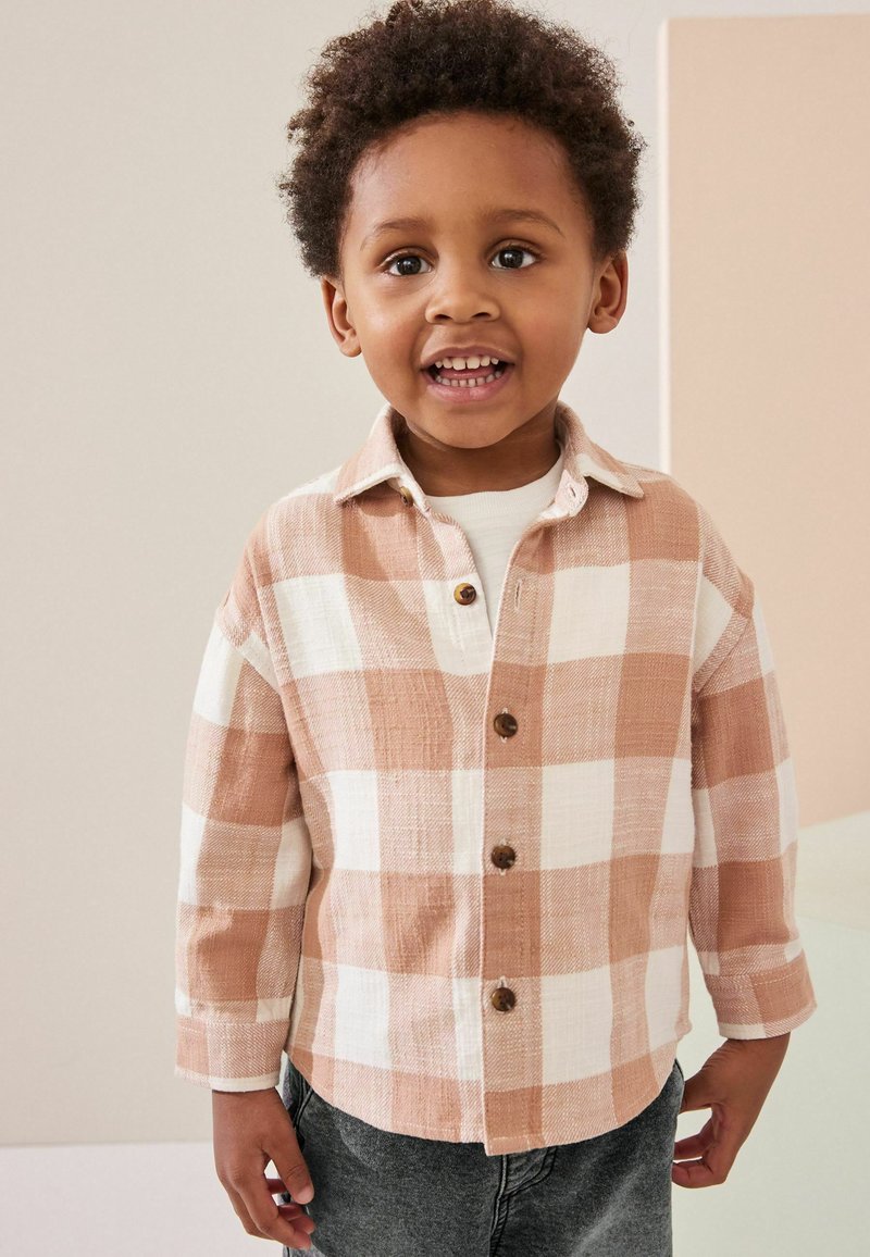 Next Pluus - rust brown